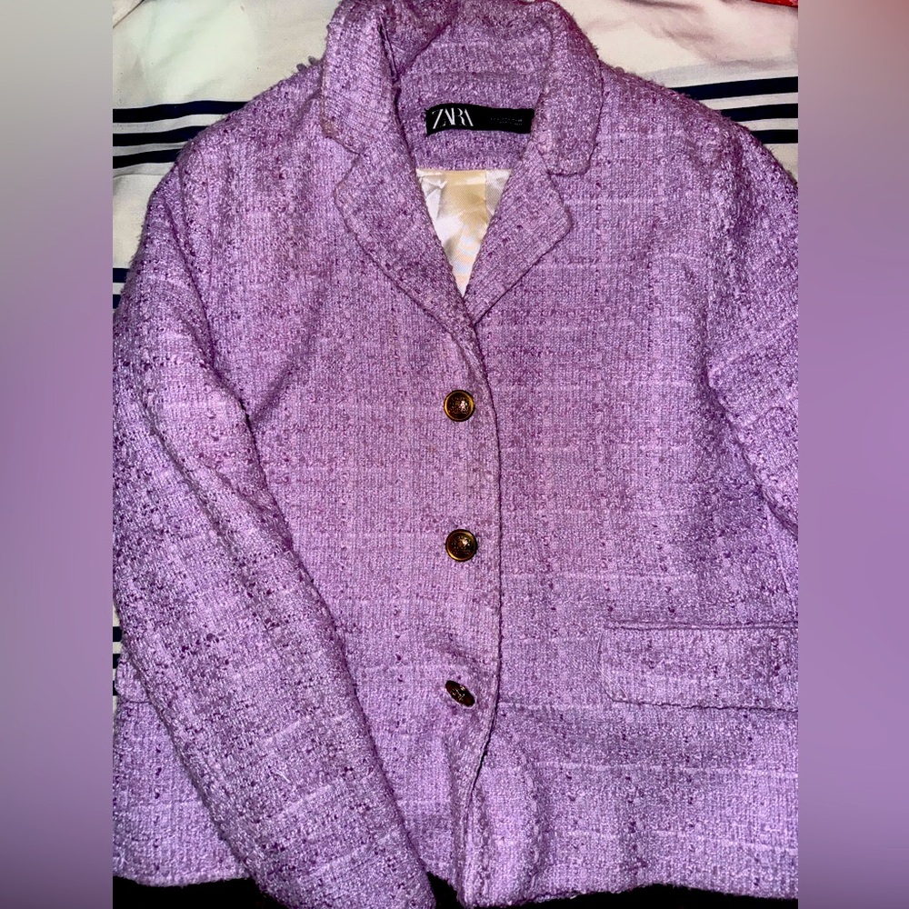 Light purple blazer with gold buttons